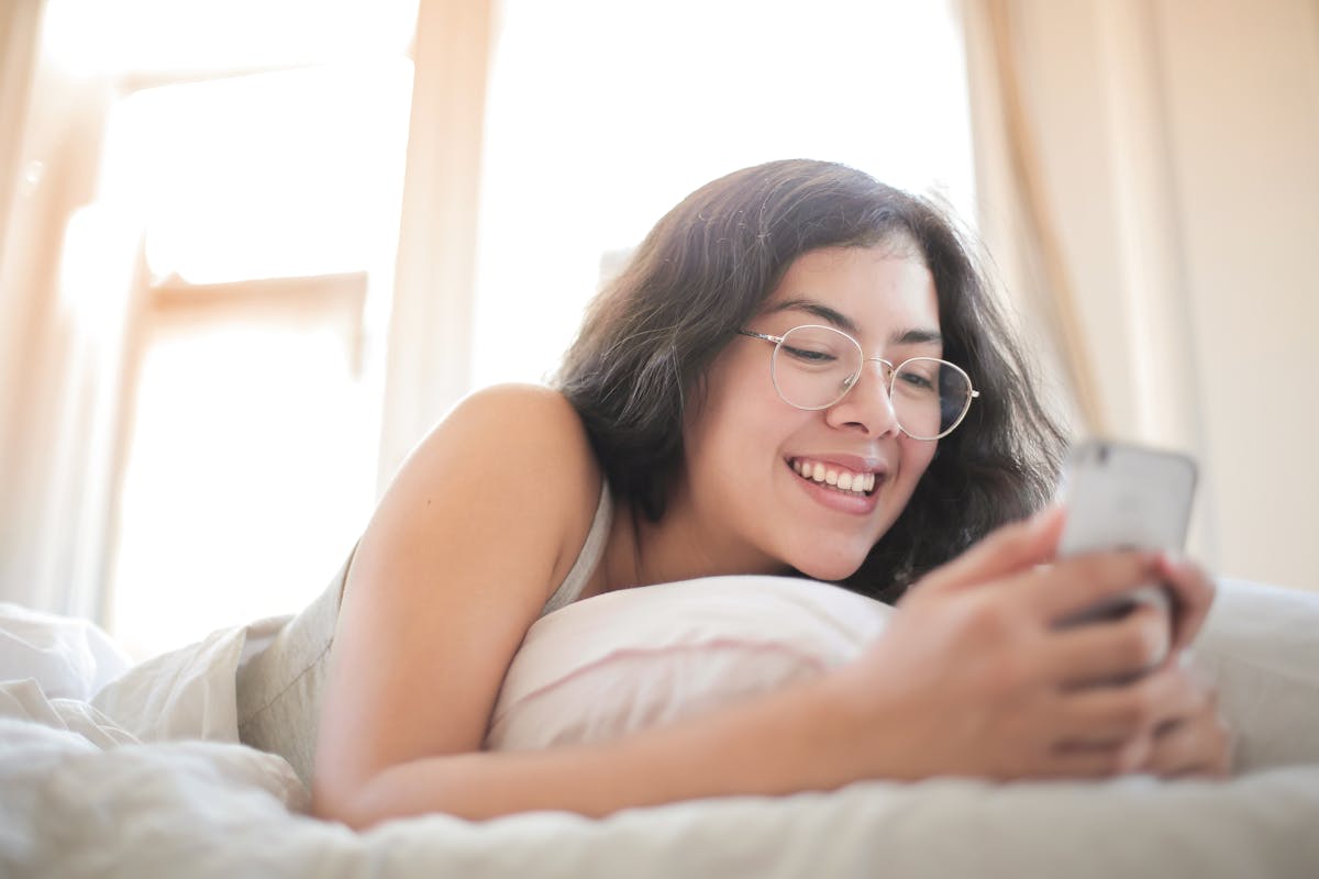 A messaging team member responding to fan chats on a screen