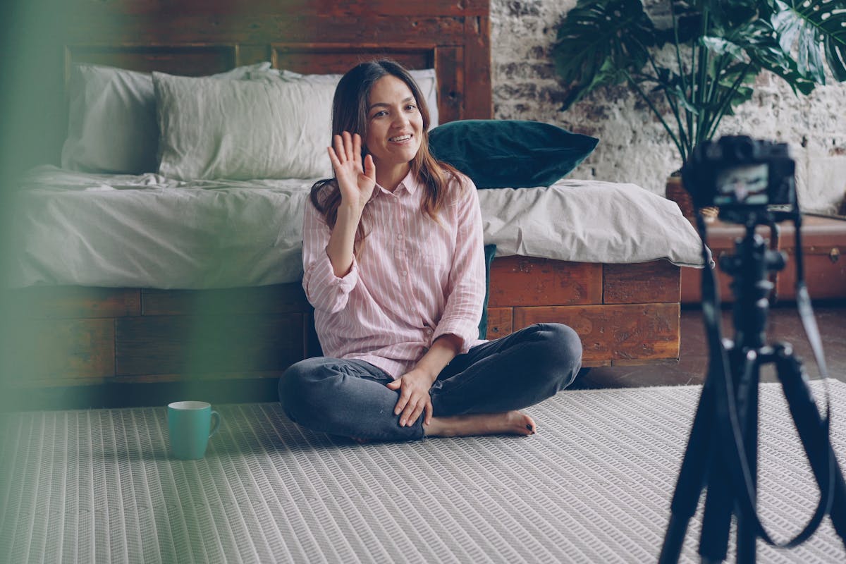 A creator planning a content calendar with notes and a phone on a tripod
