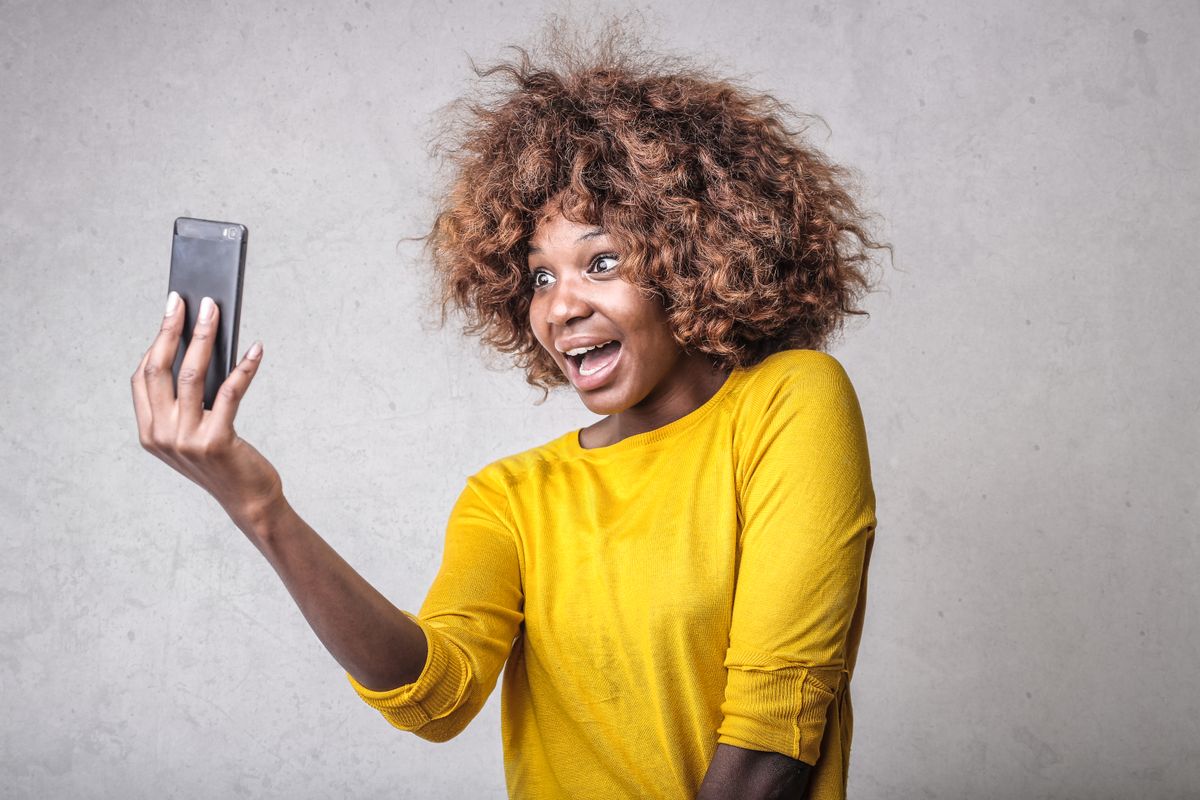 A creator recording a casual vertical video on a phone for Snapchat